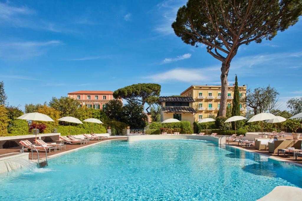 Outdoor swimming pool area at Grand Hotel Excelsior Vittoria, one of the luxurious five star hotels in Sorrento Italy.